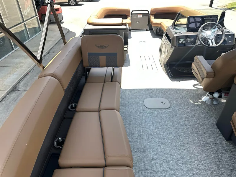 Slide: The Image of The image shows the interior of a 2026 Bennington 24 MSL with luxurious seating and a modern helm. - 11