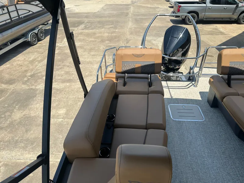 Slide: The Image of The image shows the interior of a 2026 Bennington 24 MSL boat with beige seating. - 10