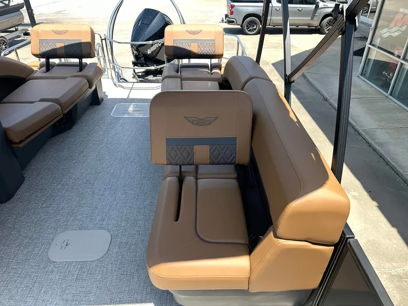 Slide: The Image of The image shows the interior of a 2026 Bennington 24 MSL with sleek brown seating. - 9