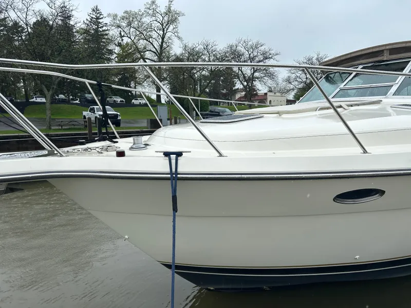 Slide: The Image of 1997 Tiara Yachts 3500 Express docked, showcasing sleek design and sturdy railings. - 10