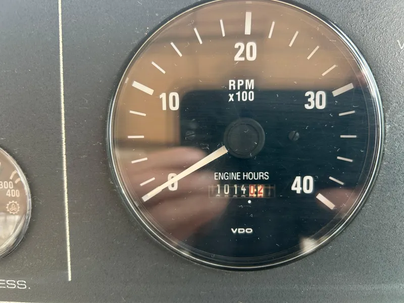 Slide: The Image of 1997 Tiara Yachts 3500 Express tachometer showing RPM and engine hours. - 14