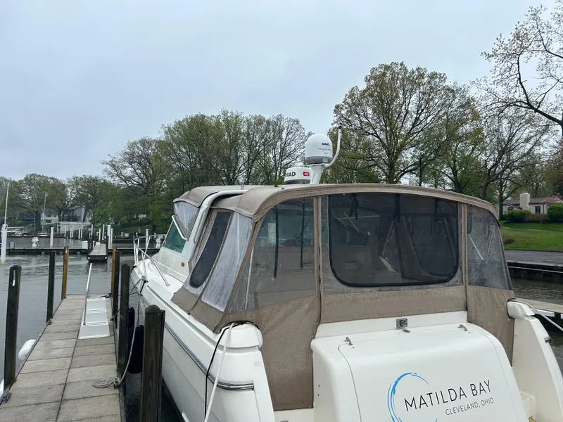 Slide: The Image of 1997 Tiara Yachts 3500 Express docked, featuring a beige canopy and "Matilda Bay" branding. - 6