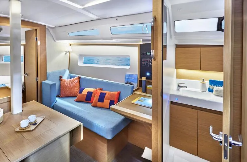 Slide: The Image of Manufacturer Provided Image: Interior of 2026 Jeanneau Sun Odyssey 380 yacht, featuring modern design and cozy seating. - 7