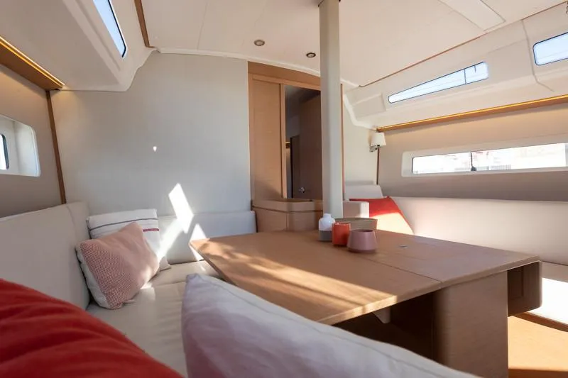 Slide: The Image of Manufacturer Provided Image: Interior of 2026 Jeanneau Sun Odyssey 380 yacht, featuring modern seating and natural light. - 8