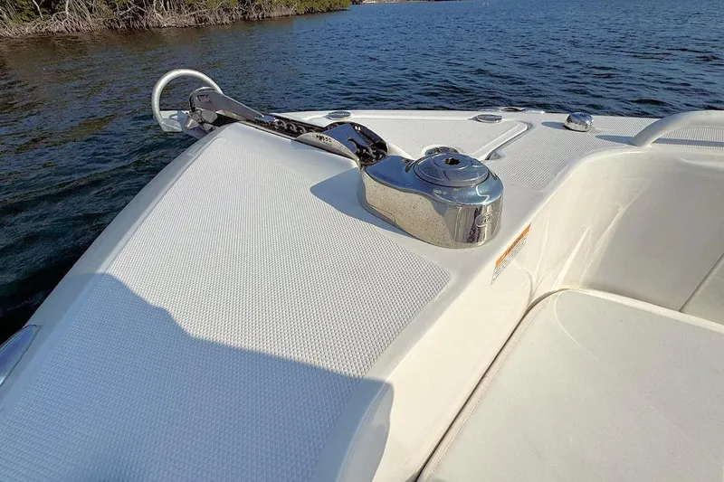 Slide: The Image of Bow of 2012 Everglades 295 Center Console boat with anchor and water view. - 16