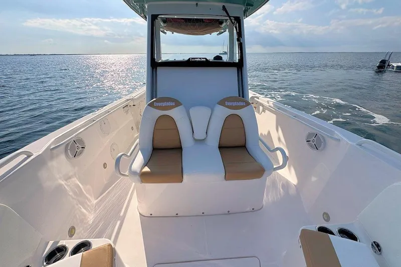Slide: The Image of 2012 Everglades 295 Center Console boat interior with dual seats on open water. - 17