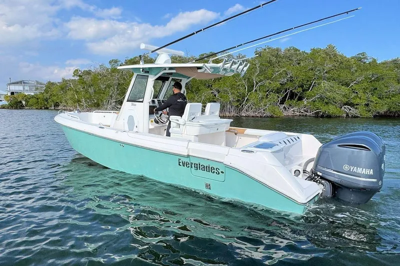 Slide: The Image of 2012 Everglades 295 Center Console boat with Yamaha engine on calm water. - 5