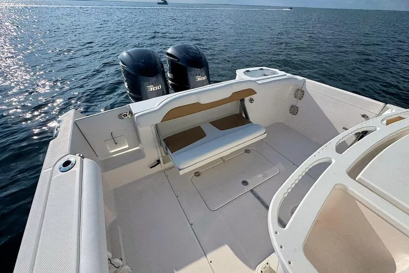 Slide: The Image of 2012 Everglades 295 Center Console boat with dual 300 horsepower engines on open water. - 7