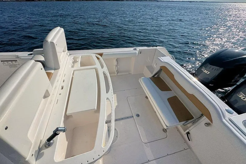 Slide: The Image of 2012 Everglades 295 Center Console boat interior with seating and ocean view. - 8