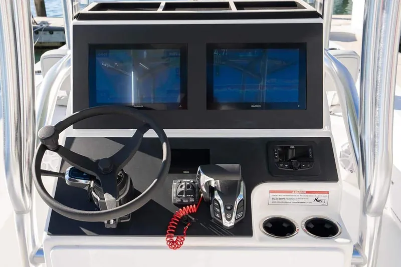 Slide: The Image of Manufacturer Provided Image: 2025 Bay Rider 269 Bay boat console with dual screens and steering wheel. - 11
