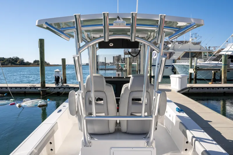 Slide: The Image of 2026 Bay Rider 269 Bay boat docked at marina, featuring sleek design and modern amenities. - 13