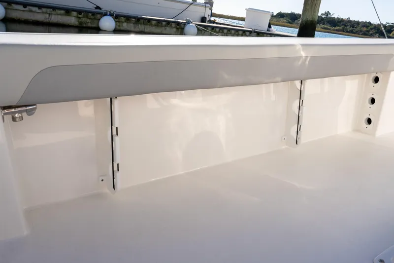 Slide: The Image of 2026 Bay Rider 269 Bay boat interior detail with clean white finish and hardware. - 21