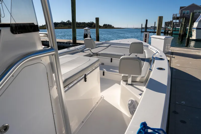 Slide: The Image of 2026 Bay Rider 269 Bay boat docked, featuring spacious seating and sleek design. - 24