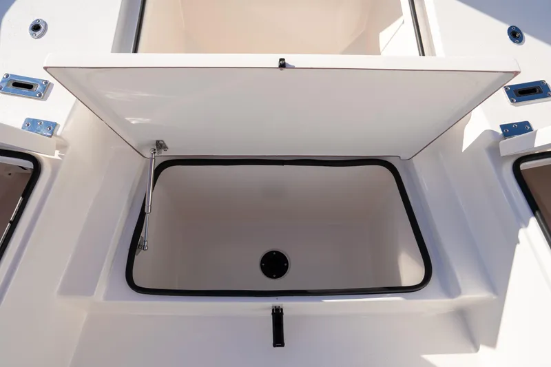 Slide: The Image of Open storage compartment on 2026 Bay Rider 269 Bay boat. - 32