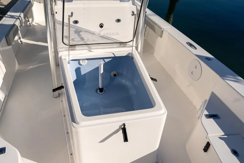 Slide: The Image of 2026 Bay Rider 269 Bay boat interior with open storage compartment. - 34