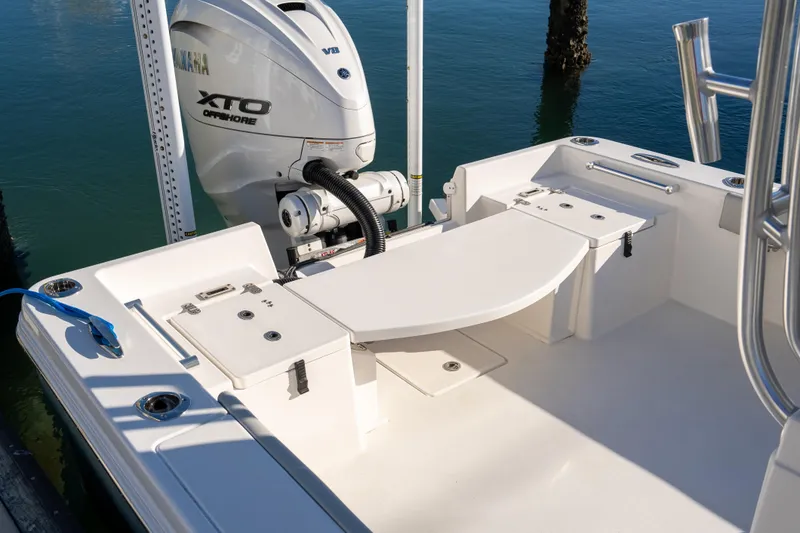 Slide: The Image of 2026 Bay Rider 269 Bay boat with Yamaha XTO Offshore engine, docked on calm water. - 41