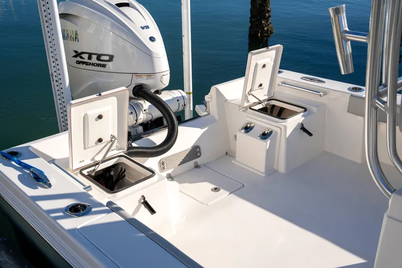 Slide: The Image of 2026 Bay Rider 269 Bay boat with Yamaha XTO Offshore engine, open storage compartments. - 42