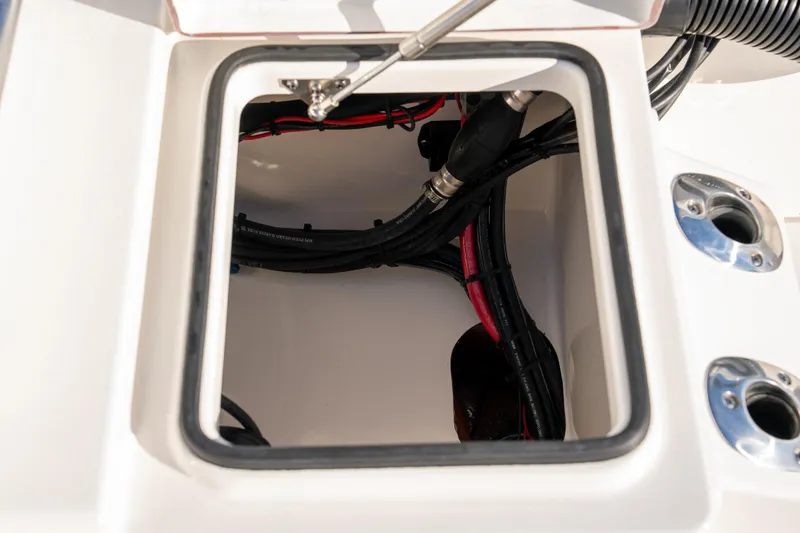 Slide: The Image of Open compartment of 2026 Bay Rider 269 Bay boat showing internal wiring. - 43