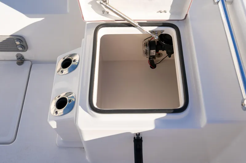 Slide: The Image of Open storage compartment on 2026 Bay Rider 269 Bay boat deck. - 44