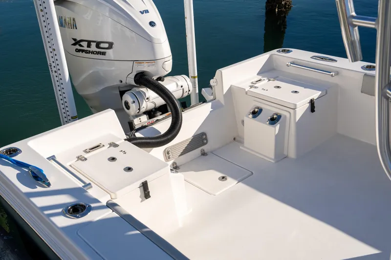 Slide: The Image of 2026 Bay Rider 269 Bay boat with Yamaha XTO Offshore engine, docked on calm water. - 47