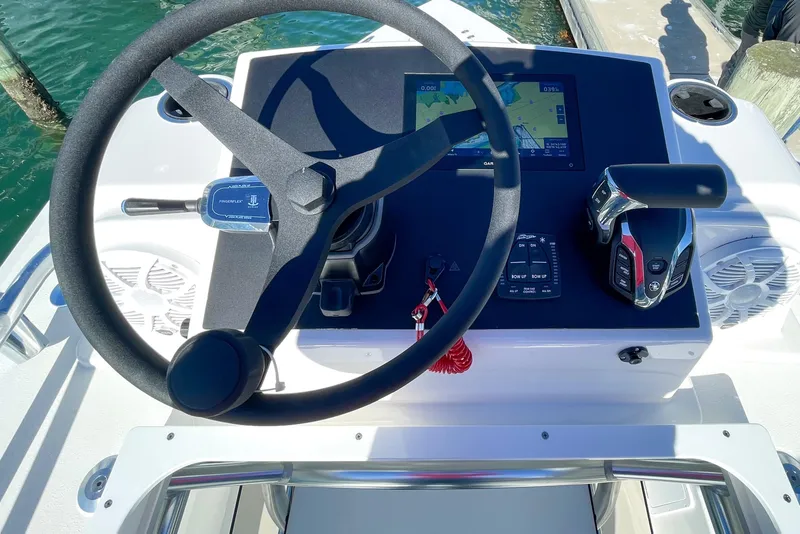 Slide: The Image of Steering console of 2026 Bay Rider 269 Bay boat with navigation display. - 50