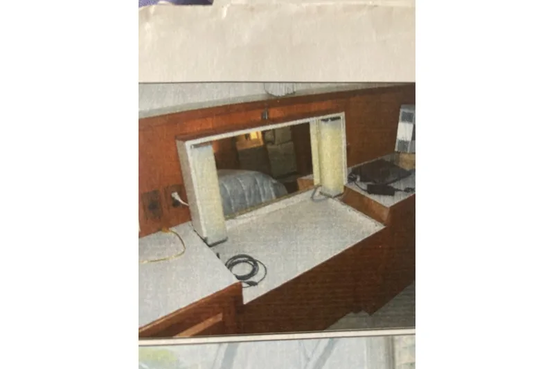 Slide: The Image of Interior of 1985 Bertram 58 Flybridge Motor Yacht with vanity and mirror. - 13