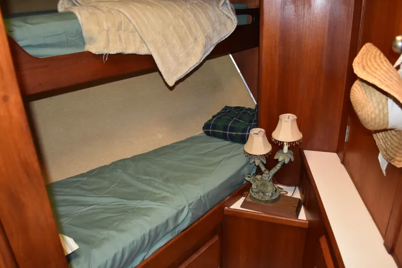 Slide: The Image of Cozy cabin with bunk beds in 1985 Bertram 58 Flybridge Motor Yacht. - 31