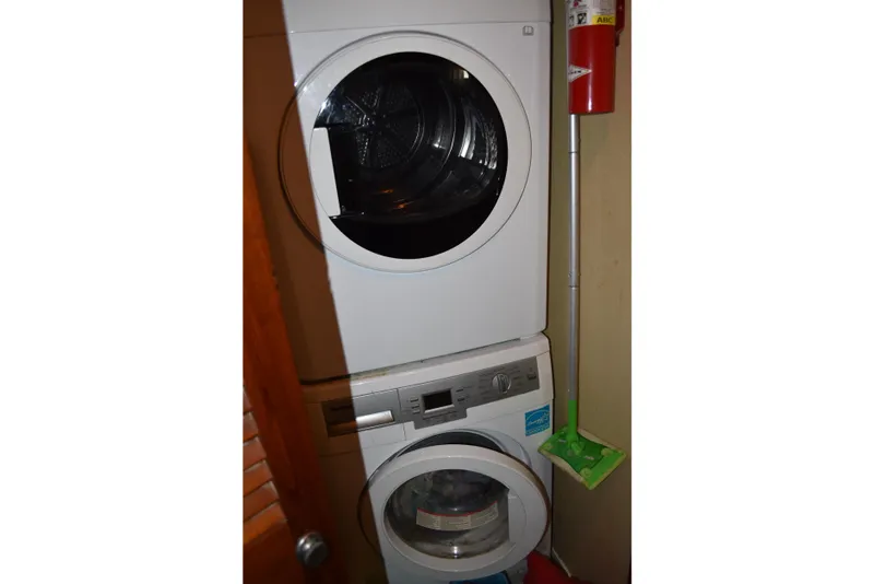 Slide: The Image of Stacked washer and dryer in Bertram 58 Flybridge Motor Yacht, 1985 model. - 36