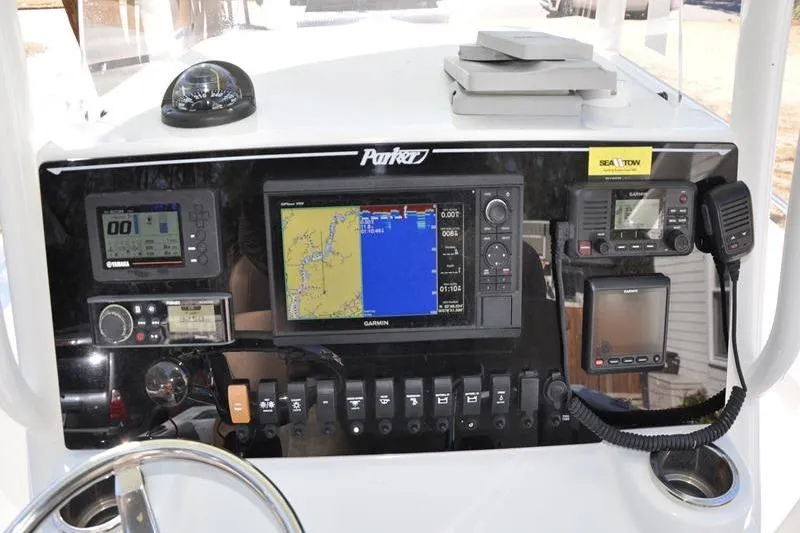Slide: The Image of Control panel of a 2018 Parker 2300 Center Console boat with navigation equipment. - 18