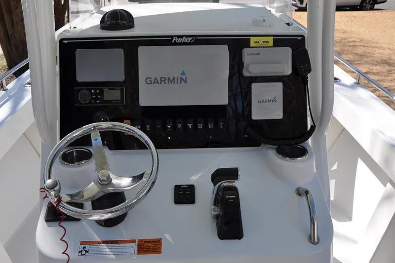 Slide: The Image of 2018 Parker 2300 Center Console boat dashboard with Garmin navigation system. - 24