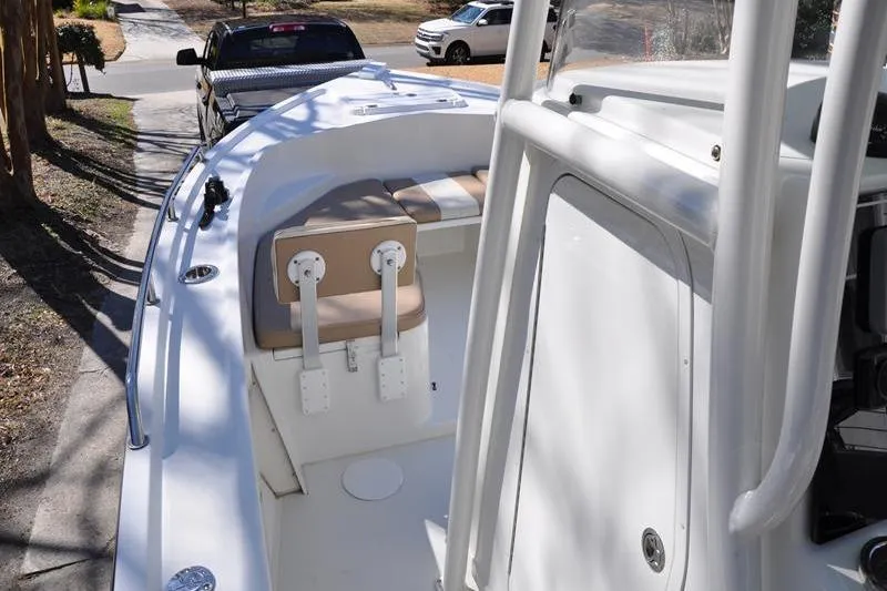 Slide: The Image of 2018 Parker 2300 Center Console boat with seating, parked on a street. - 27
