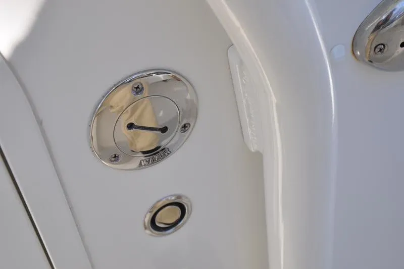Slide: The Image of Close-up of a 2018 Parker 2300 Center Console boat's fuel cap and fitting. - 30
