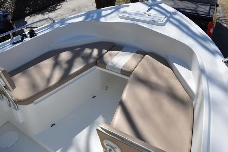 Slide: The Image of 2018 Parker 2300 Center Console boat with cushioned seating area. - 33
