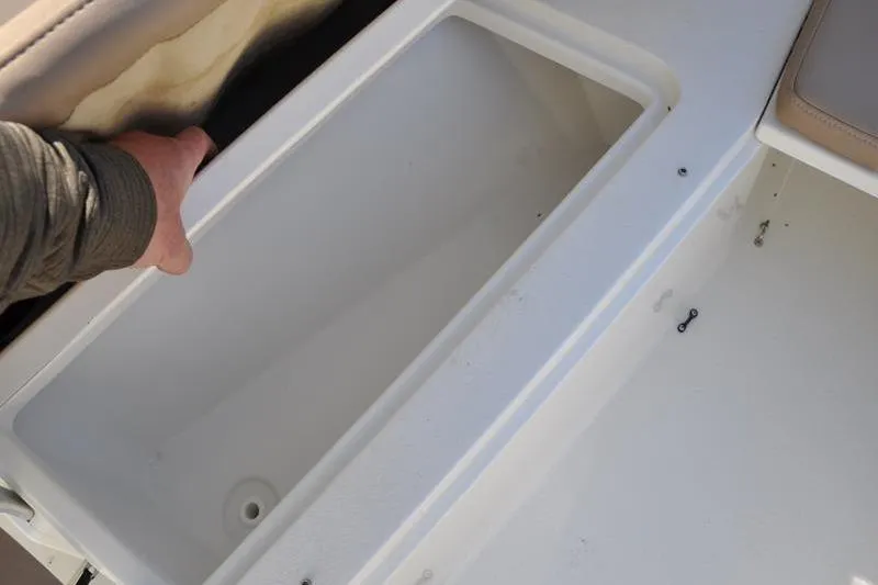 Slide: The Image of Open storage compartment on 2018 Parker 2300 Center Console boat. - 35