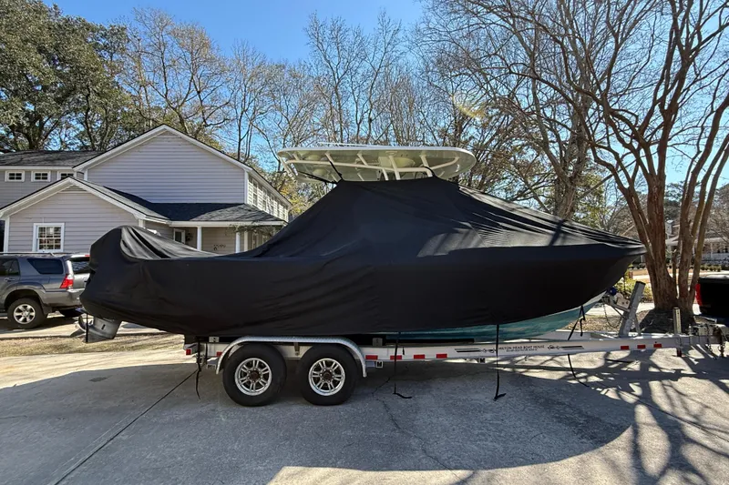 Slide: The Image of 2018 Parker 2300 Center Console boat covered on trailer in residential driveway. - 39