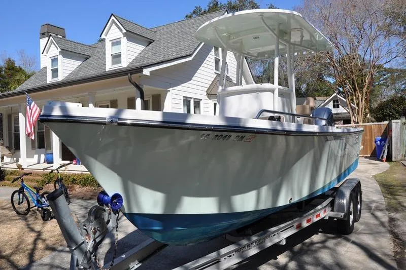 Slide: The Image of 2018 Parker 2300 Center Console boat on trailer in residential driveway. - 4
