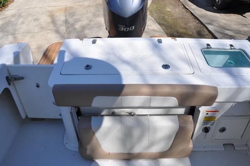 Slide: The Image of 2018 Parker 2300 Center Console boat with Yamaha 300 engine, rear seating, and storage compartments. - 8