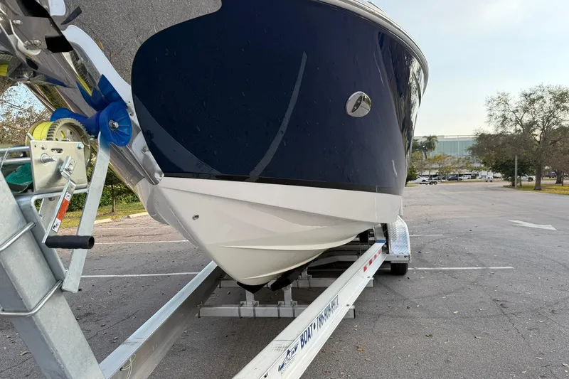 Slide: The Image of 2019 Regal 29 OBX boat on trailer in parking lot, front view. - 10