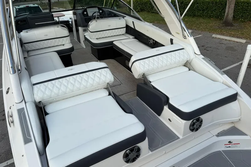 Slide: The Image of 2019 Regal 29 OBX boat interior with luxurious white seating and modern design. - 14