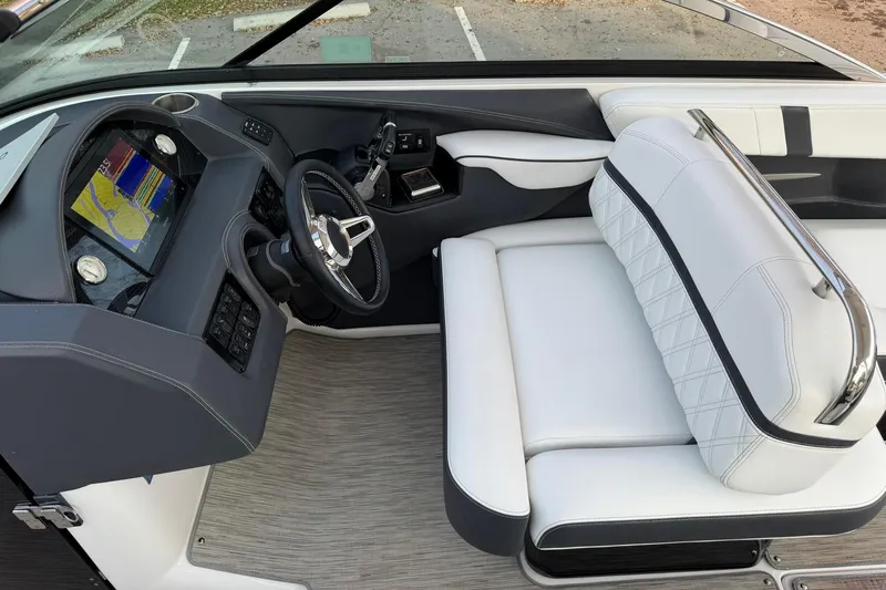 Slide: The Image of 2019 Regal 29 OBX boat interior with modern dashboard and white seating. - 26