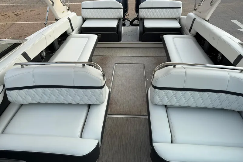 Slide: The Image of 2019 Regal 29 OBX boat interior with luxurious white seating and spacious layout. - 32
