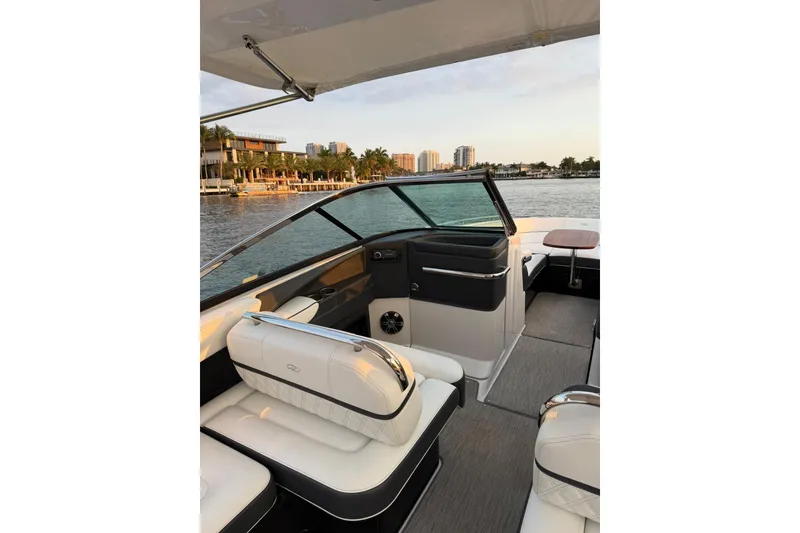 Slide: The Image of 2019 Regal 29 OBX boat interior with luxurious seating and waterfront view. - 39