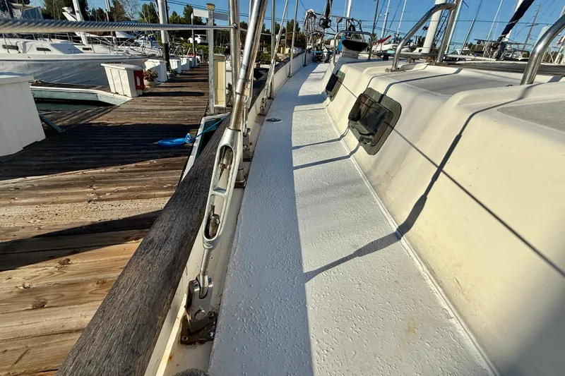 Slide: The Image of 1981 Mariner Mayflower yacht deck at marina, showcasing sleek design and sturdy construction. - 11