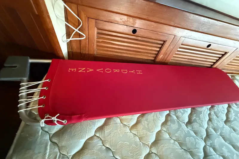 Slide: The Image of Red padded seat on 1981 Mariner Mayflower boat, wooden interior, nautical design. - 30