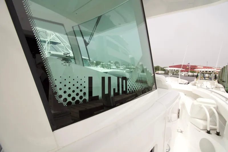 Slide: The Image of 2027 HCB 42 Lujo boat with sleek design and modern window graphics. - 5
