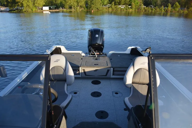 Slide: The Image of 2023 Starcraft Delta 178 SC Pro fishing boat on trailer, parked outdoors. - 12