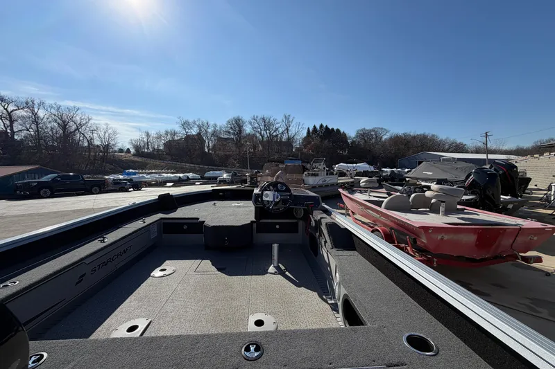 Slide: The Image of 2023 Starcraft Delta 178 SC Pro boat on trailer, parked outside Mercury Outboards. - 2