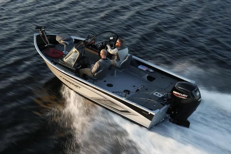 Slide: The Image of 2023 Starcraft Delta 178 SC Pro boat interior with storage compartments and motor. - 4