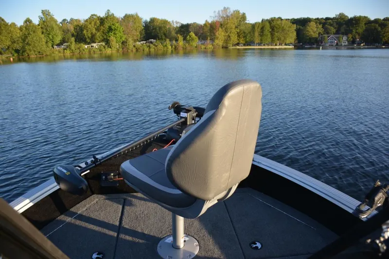 Slide: The Image of 2023 Starcraft Delta 178 SC Pro boat interior with carpeted deck and storage compartments. - 8