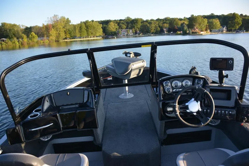 Slide: The Image of 2023 Starcraft Delta 178 SC Pro boat dashboard with steering wheel and control panel. - 9